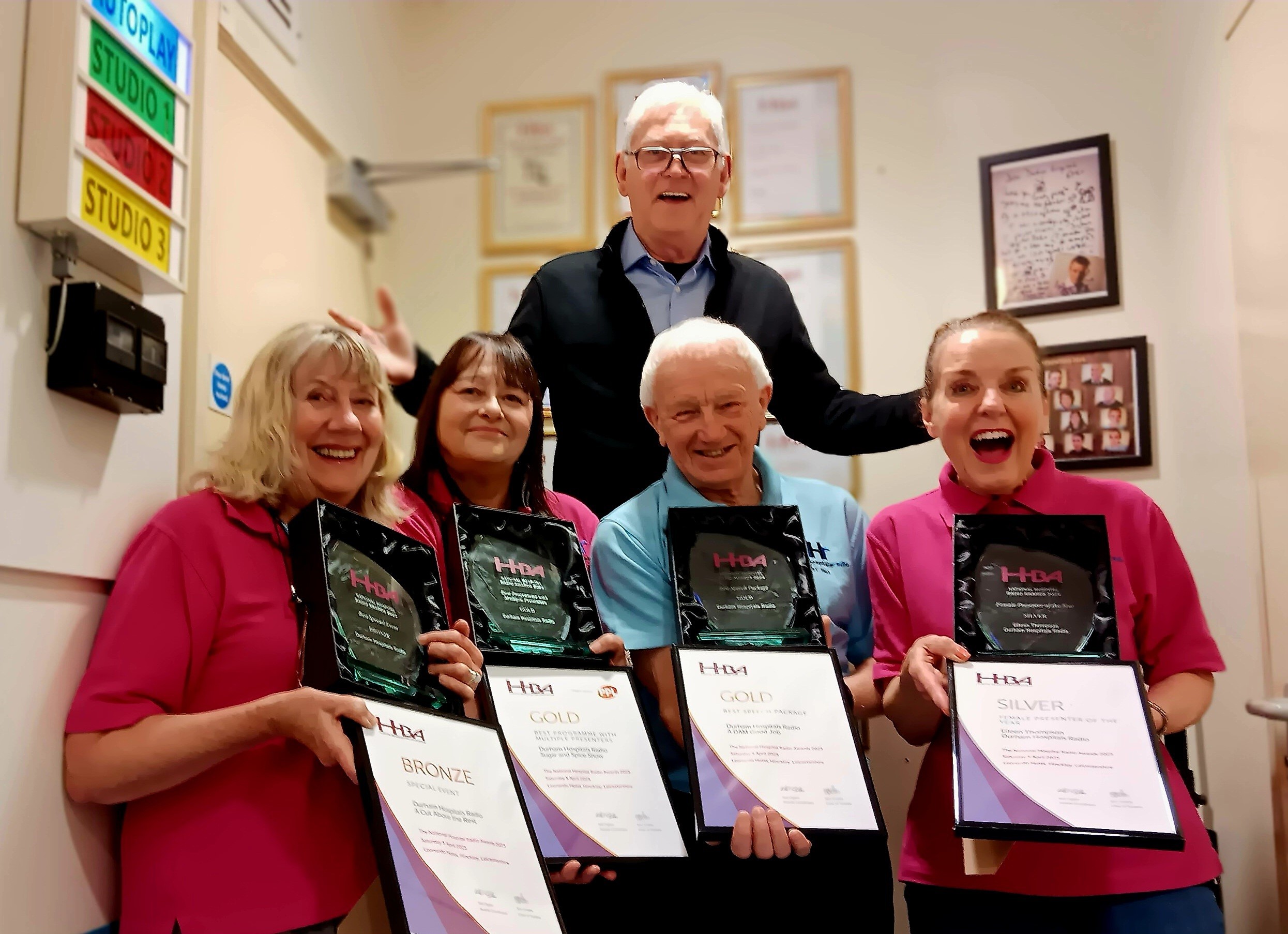 People holding awards smiling