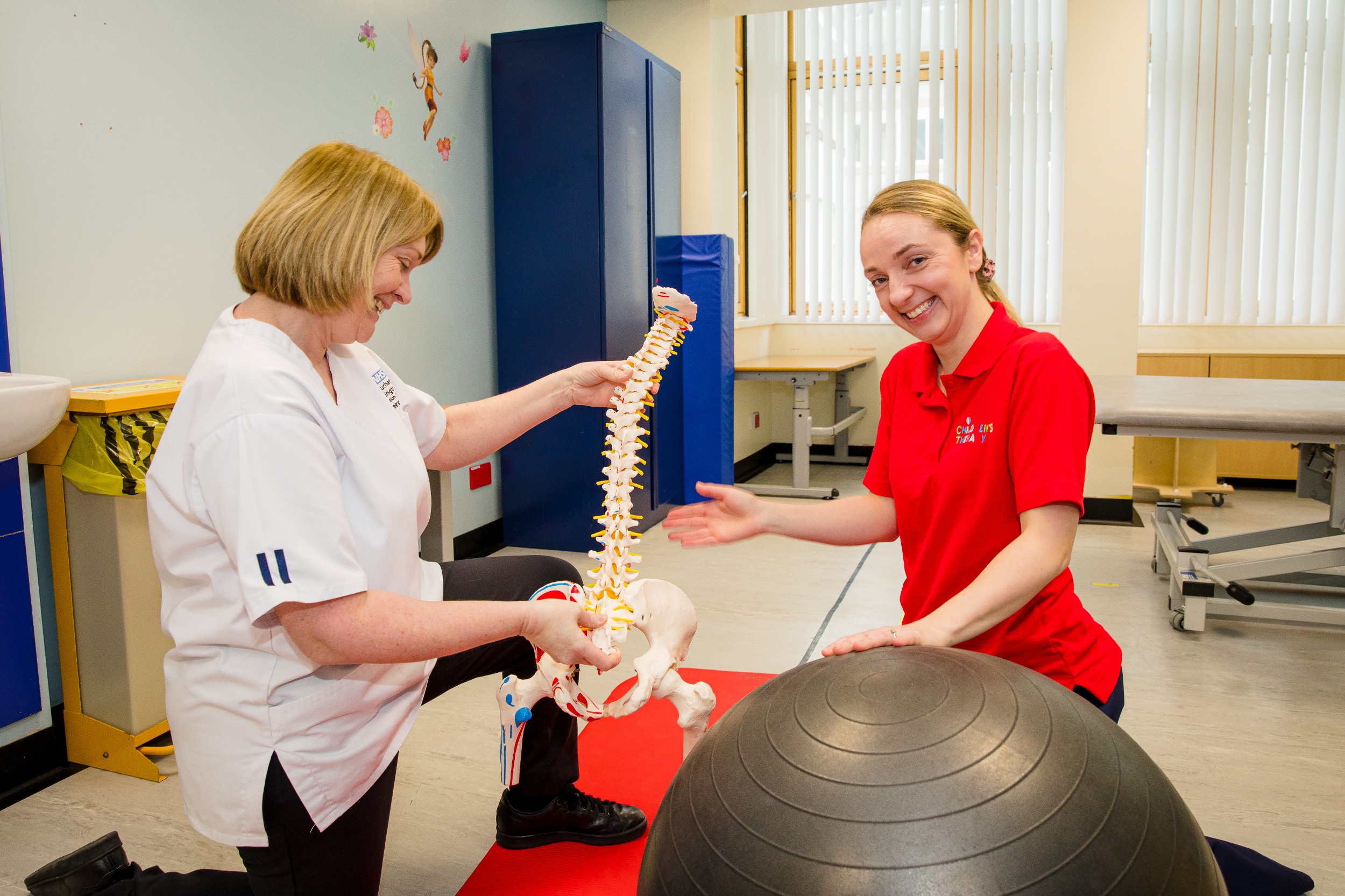 Physiotherapsits in gym with equipment