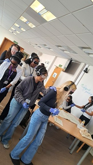 Group of young people with virtual reality head sets on