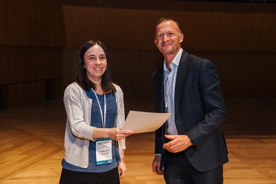 Woman and man with certificate smiling