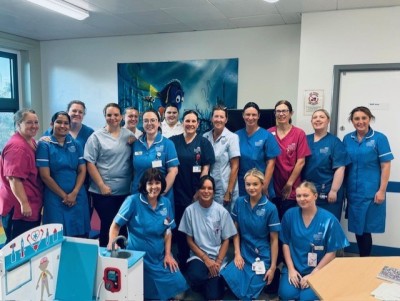 Nurses on a ward smiling