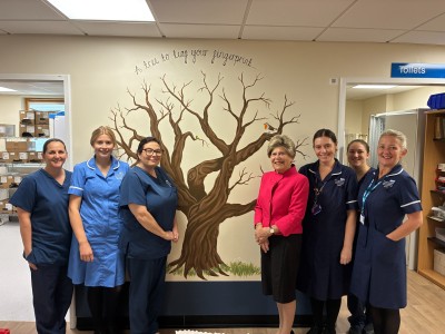 Staff with the new tree smiling