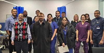 People standing in a group smiling