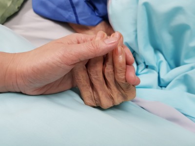 close up on hand holding older and younger hands.jpg