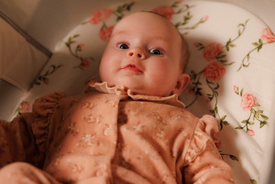Baby in cot smiling