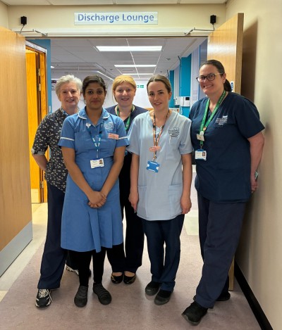 Photo of staff standing outside discharge lounge at DMH