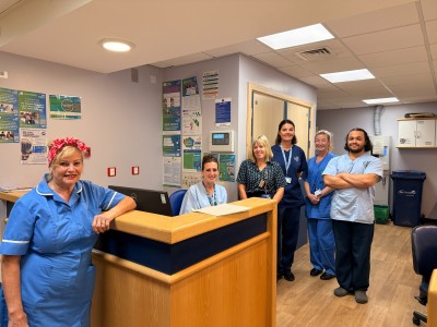 Nursing staff smiling at the nurse's station