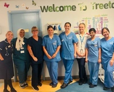 Nurses on a ward smiling