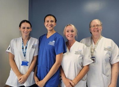 Women in scrubs smiling