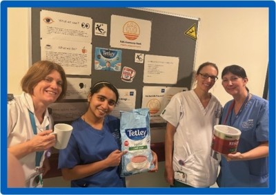 Ward staff holding a big bag of tea bags