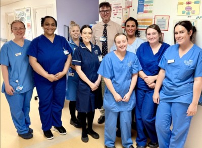 nursing staff in uniform smiling on a ward