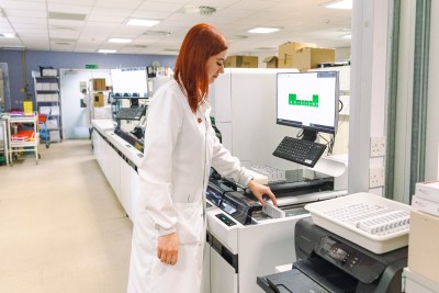 Woman in white in a laboratory