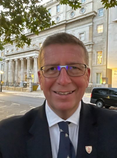 Man in suit and tie smiling