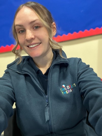 Woman in blue smiling