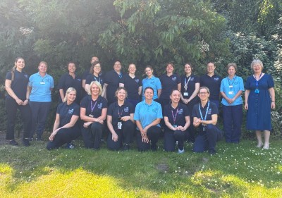 Group of staff outside smiling