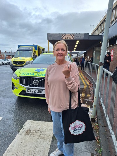 woman holding bag outside hospital