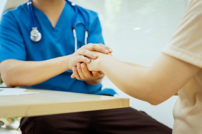 patient support hand holding care nurse.jpg
