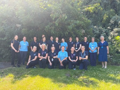 Group of staff outside smiling