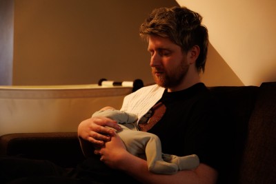 Photo of baby and dad asleep