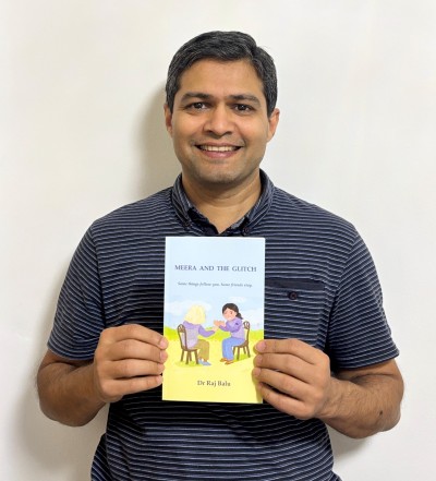 Man holding book smiling