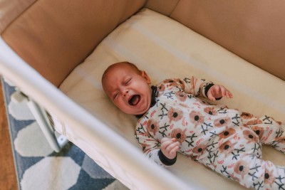 Baby crying in cot
