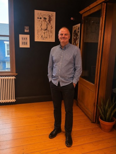 Man standing in room smiling